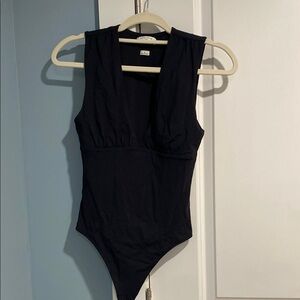 Aritzia Black Bodysuit One Piece Sleek Design
Like new, wear it one time.